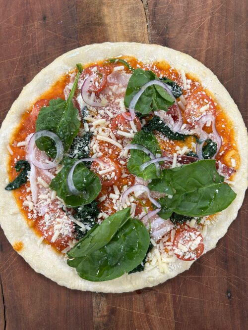 Vers belegde pizza's om zelf thuis af te bakken